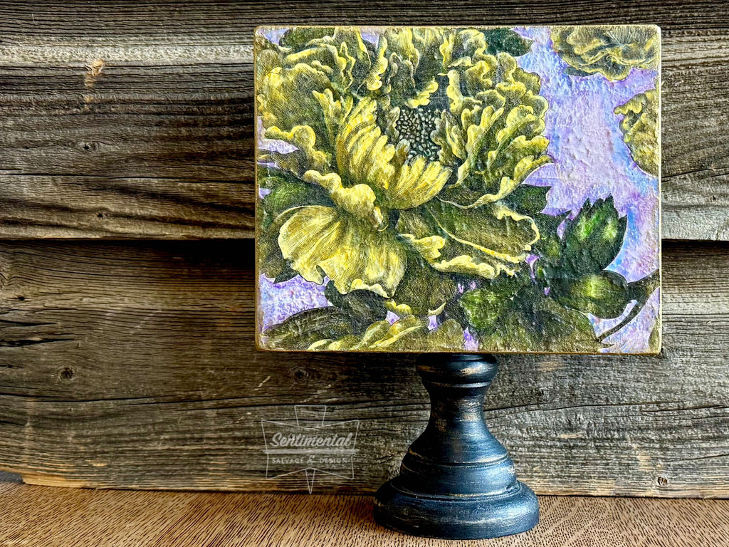 Painted decoupage paper on a pedestal art board.